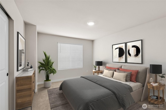 bedroom featuring a closet, carpet flooring, and baseboards