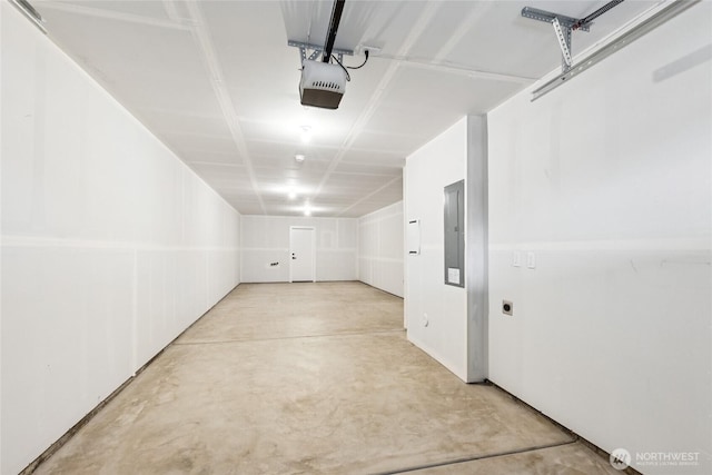 garage featuring electric panel and a garage door opener