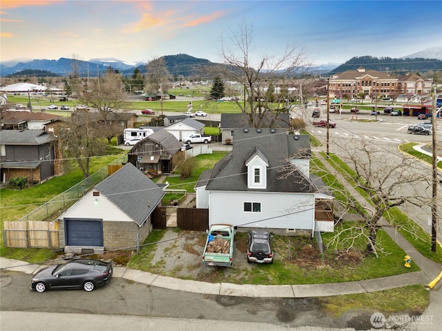 drone / aerial view featuring a residential view and a mountain view