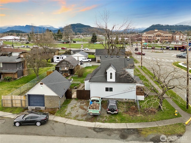 birds eye view of property with a residential view and a mountain view