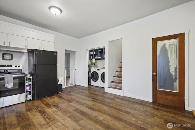 kitchen featuring washing machine and clothes dryer, dark wood-type flooring, stainless steel electric range oven, freestanding refrigerator, and white cabinets