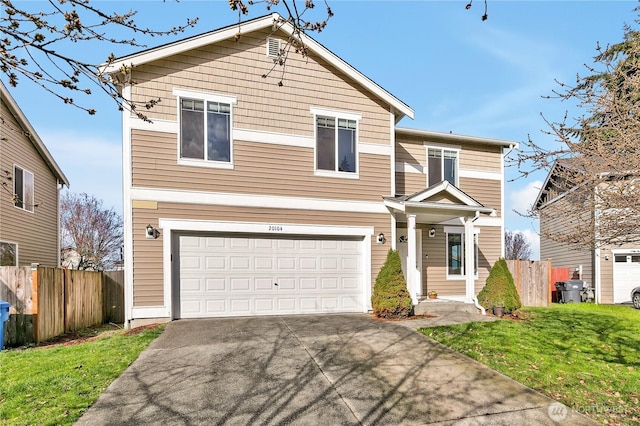 view of front of house with an attached garage, concrete driveway, a front lawn, and fence