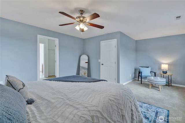 bedroom featuring visible vents, baseboards, carpet, and a ceiling fan