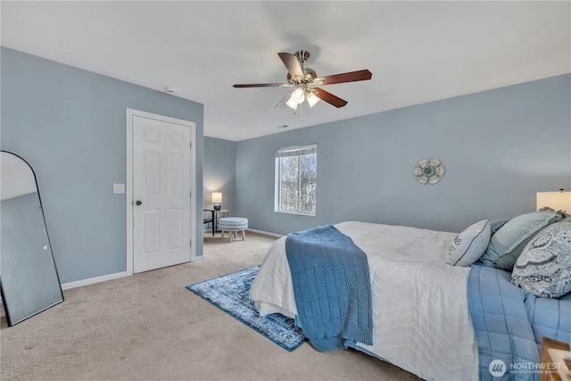 bedroom featuring a ceiling fan, baseboards, and carpet floors