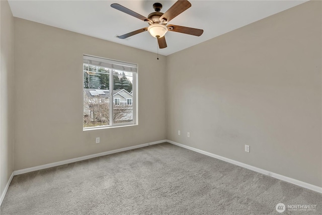 unfurnished room with baseboards, carpet, and ceiling fan