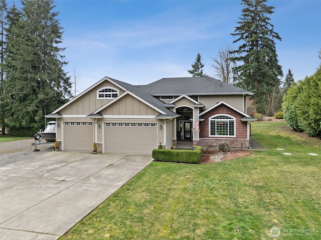 view of front of property with driveway, board and batten siding, roof with shingles, an attached garage, and a front yard