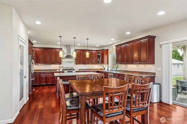 dining space with recessed lighting and dark wood-style floors