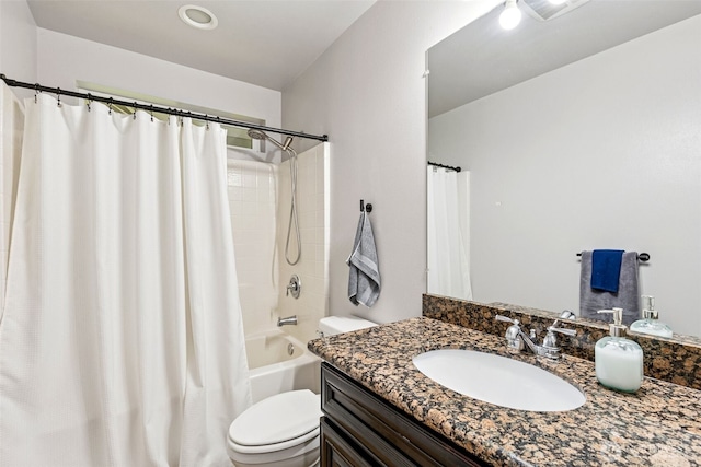 full bath with toilet, vanity, and shower / tub combo