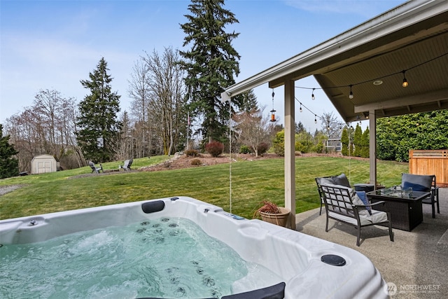 exterior space featuring an outdoor living space with a fire pit, an outbuilding, a shed, and a hot tub