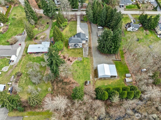 birds eye view of property with a residential view