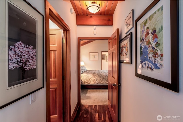 corridor with wooden ceiling and dark wood-style floors