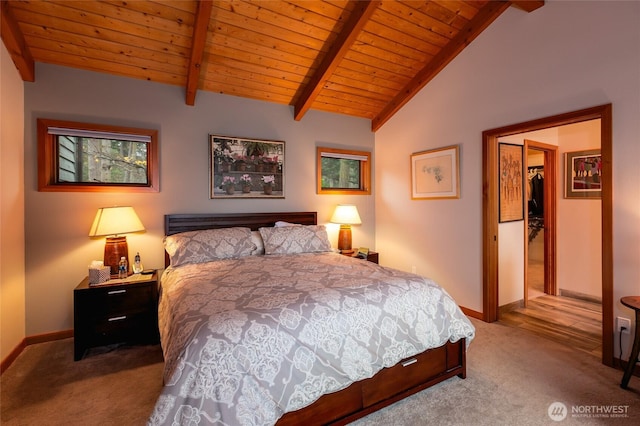 carpeted bedroom featuring baseboards, wooden ceiling, vaulted ceiling with beams, a spacious closet, and a closet