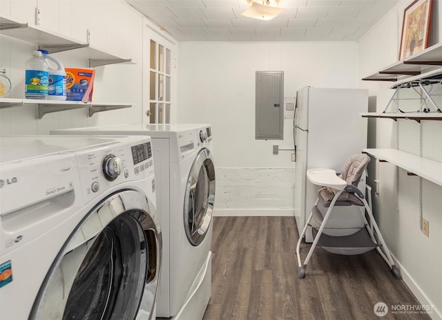 laundry area featuring baseboards, laundry area, electric panel, dark wood-type flooring, and independent washer and dryer