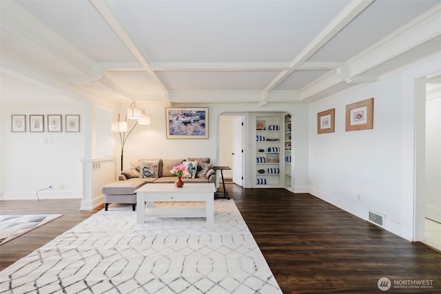 living room featuring visible vents, coffered ceiling, and wood finished floors