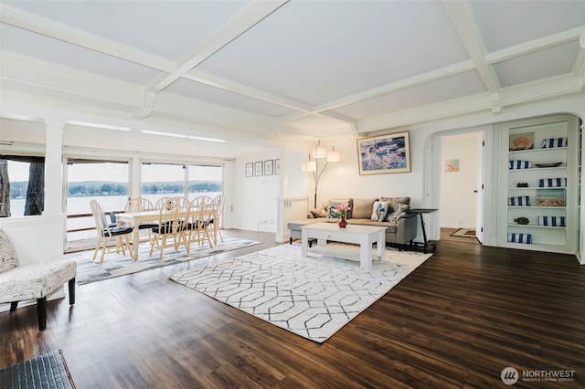 living area with beamed ceiling, coffered ceiling, baseboards, and wood finished floors