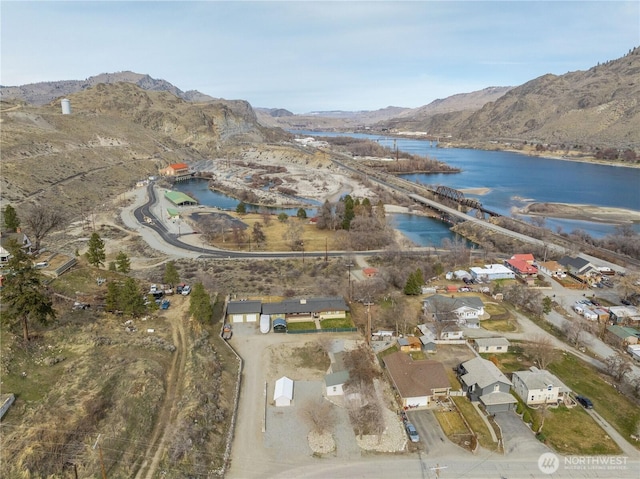 bird's eye view with a water and mountain view