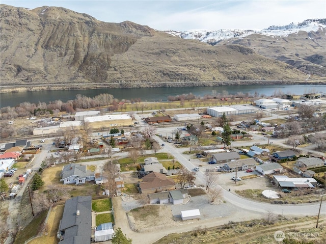 aerial view featuring a residential view and a water and mountain view