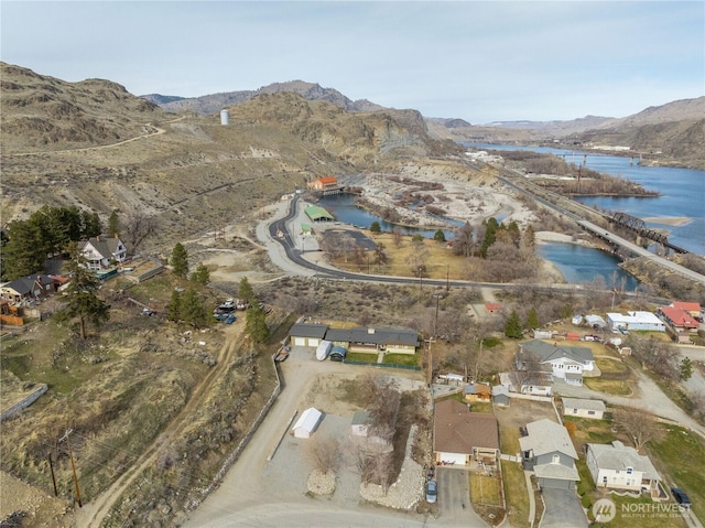 bird's eye view with a water and mountain view