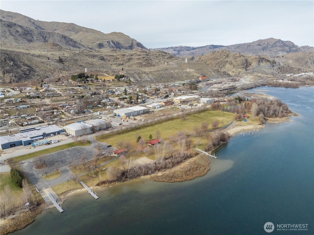 bird's eye view with a water and mountain view