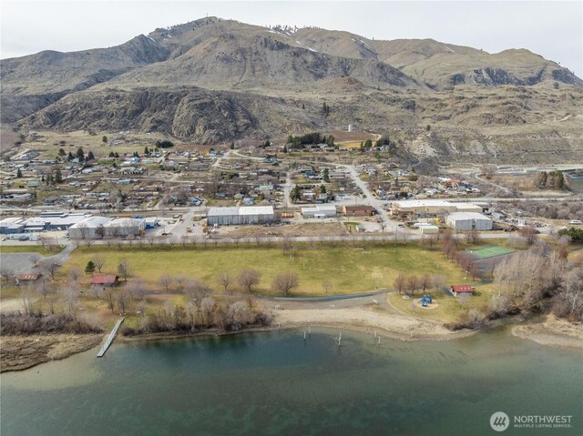 bird's eye view featuring a water and mountain view