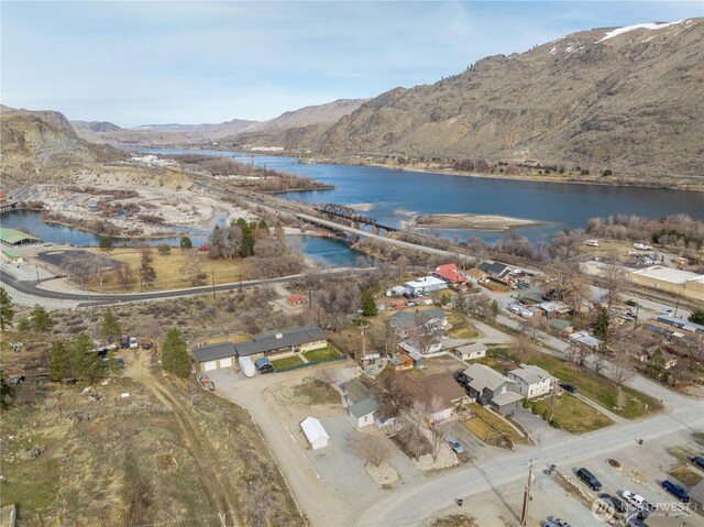 aerial view featuring a water and mountain view