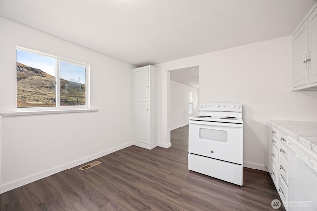 kitchen featuring white cabinetry, white appliances, light countertops, and visible vents