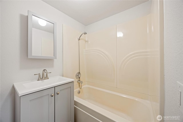 bathroom featuring vanity and shower / bathtub combination