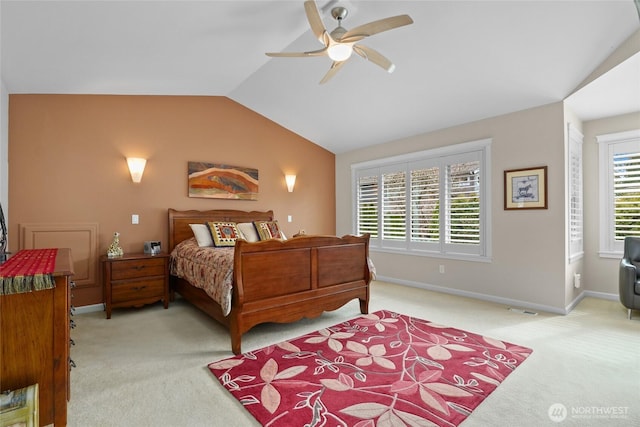 bedroom featuring baseboards, light carpet, ceiling fan, and vaulted ceiling