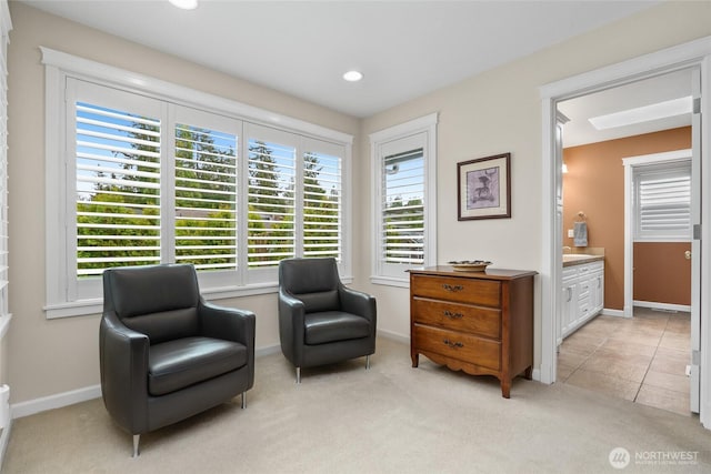 sitting room featuring light tile patterned floors, baseboards, light colored carpet, and recessed lighting