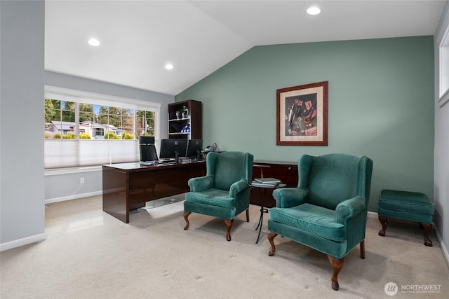 office space featuring recessed lighting, baseboards, lofted ceiling, and light colored carpet