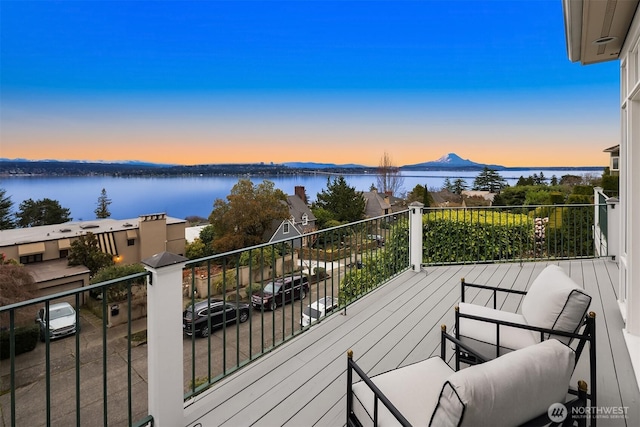 balcony featuring a water view