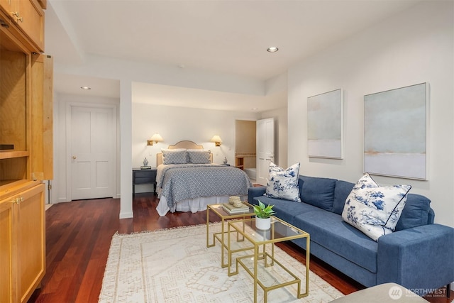 bedroom with dark wood-style floors and recessed lighting