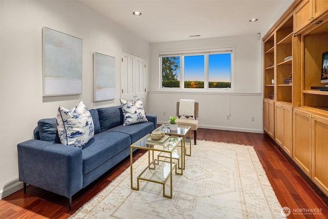 living area with recessed lighting, visible vents, baseboards, and dark wood-style floors