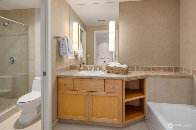 bathroom featuring visible vents, toilet, a stall shower, and vanity