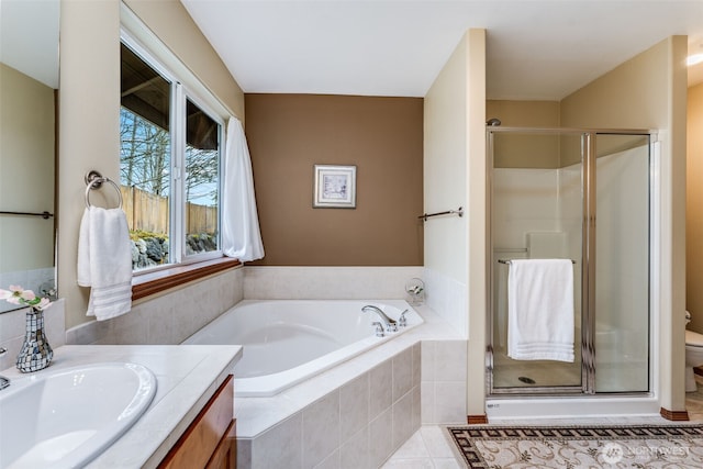 full bath with tile patterned flooring, a shower stall, toilet, a bath, and vanity