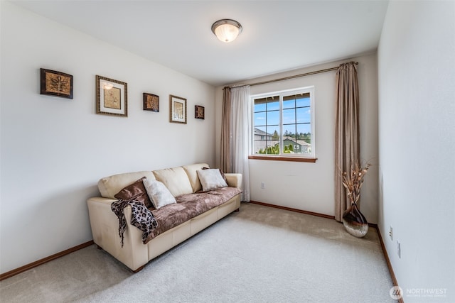 living area with carpet flooring and baseboards