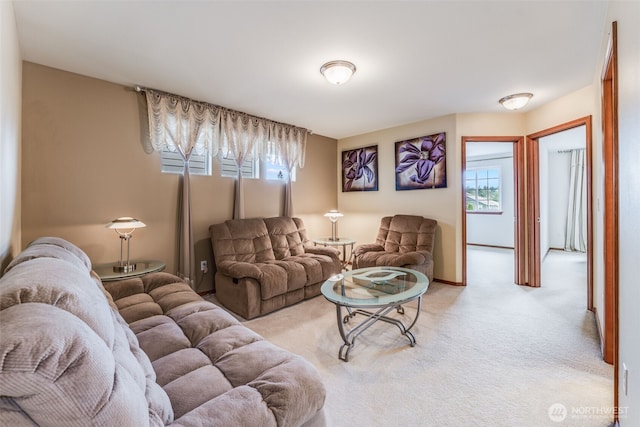 living room featuring light carpet