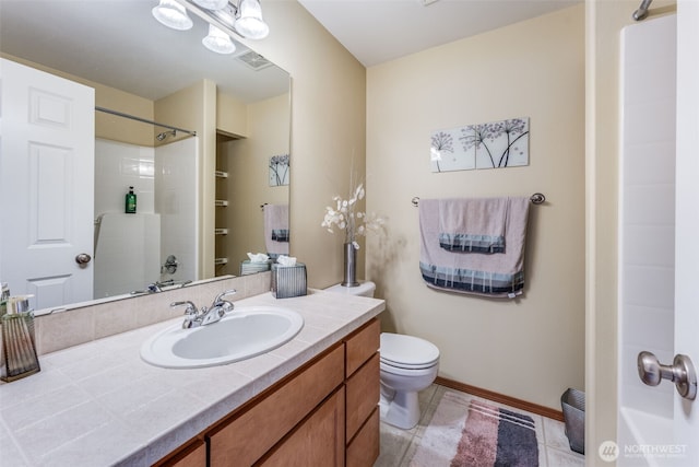 full bath featuring vanity, baseboards, tile patterned flooring, walk in shower, and toilet