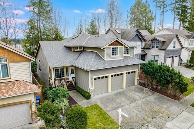 view of front of house with driveway, a residential view, a garage, and roof with shingles