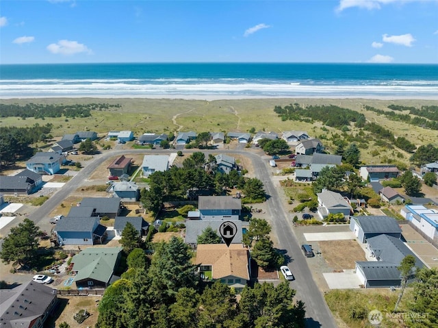 drone / aerial view with a residential view and a water view