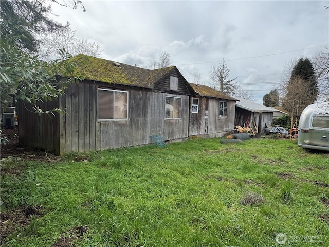 view of home's exterior featuring a yard