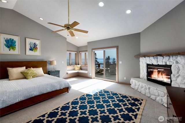 bedroom with recessed lighting, lofted ceiling, access to exterior, carpet floors, and a fireplace