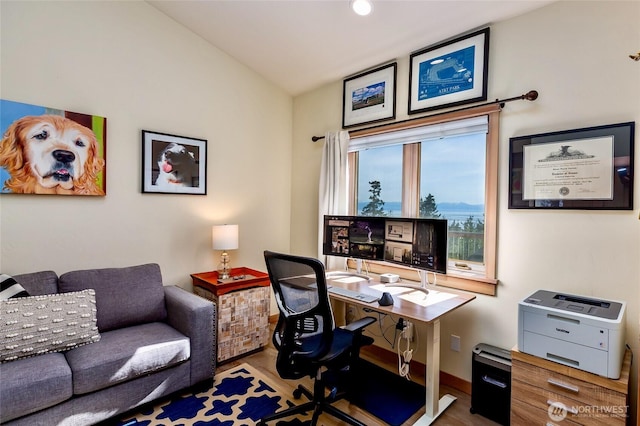office area with baseboards and wood finished floors