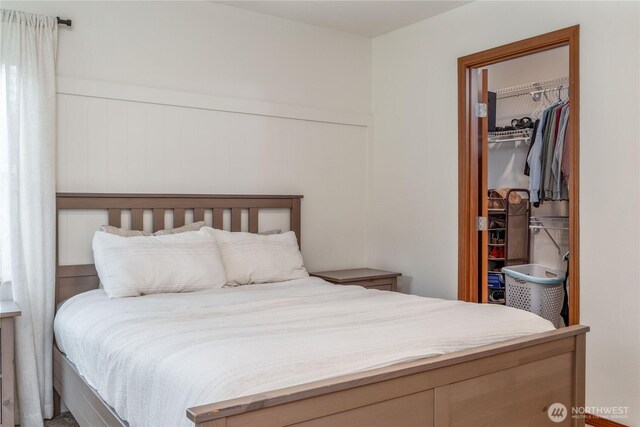 bedroom with a closet and a walk in closet