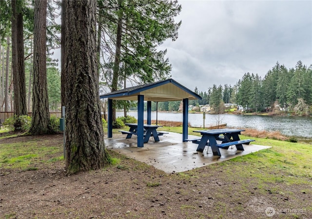 view of property's community with a gazebo and a water view