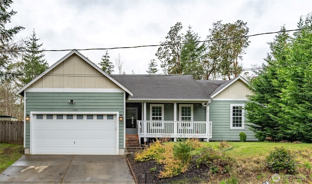ranch-style home featuring an attached garage, a shingled roof, covered porch, and concrete driveway