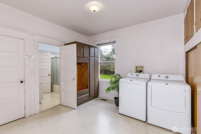 249 Cascade Ave, Langley, WA 98260 - laundry room with washing machine and dryer, visible vents, and laundry area