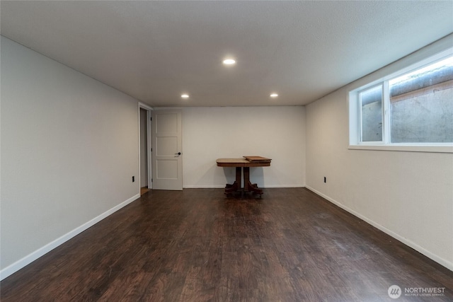 below grade area with recessed lighting, baseboards, and wood finished floors