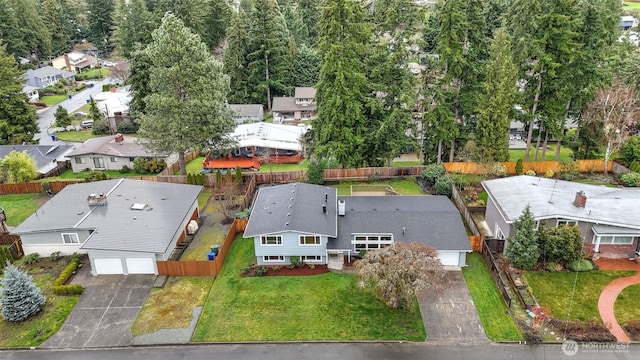 birds eye view of property with a residential view