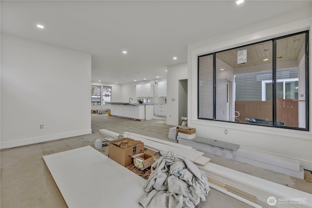 interior space with recessed lighting and baseboards